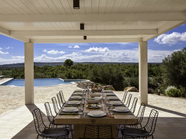 The shady al fresco dining area of the first house.